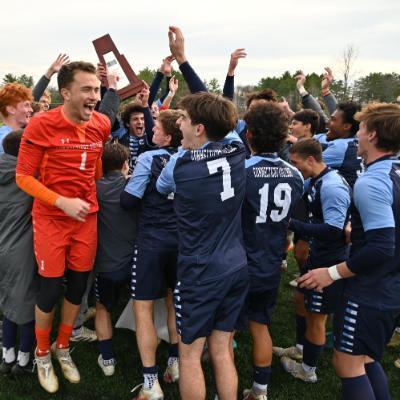 Men's soccer team celebrating win