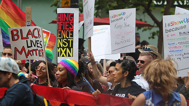 Activists with signs at a Black Lives Matter march on June 25, 2017. Image by Quinn Dombrowski, Flickr.  