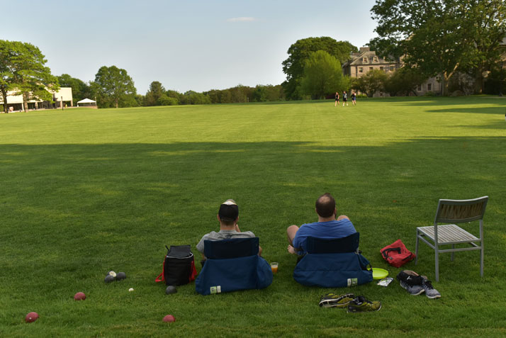 Two Alumna relaxing on Tempel Green