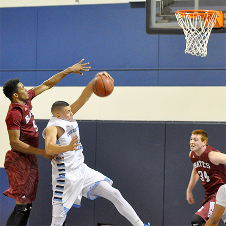 Zuri Pavlin '17 grabs a rebound in a game against Bates College. 