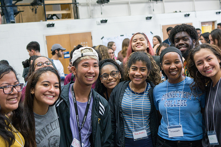 Students pose during an arrival day event. 