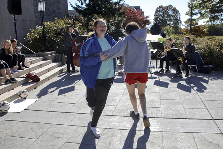 Students dance to the music provided by the Traditional Jazz Band at the groundbreaking ceremony.