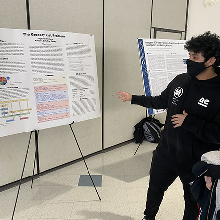 Kevin Ventura ’22 presents his poster at the symposium.