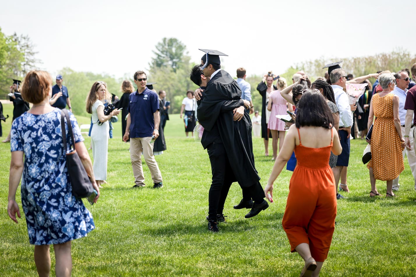 Two graduates embrace