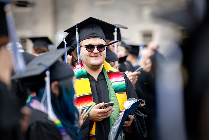 A student stands during the ceremony.