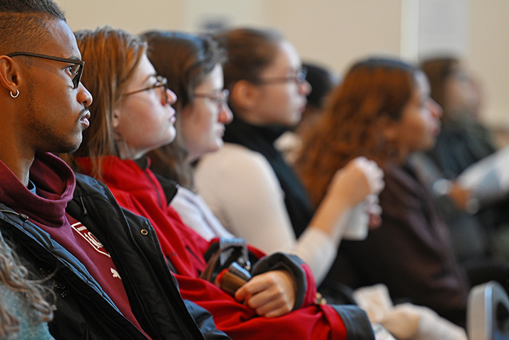 The audience listens as Sam Boehm ’24 presents his research “Catalyzing Healthcare with Intercultural Competence: The Intersection of Indigenous and Western Medicine” during the All-College Symposium.