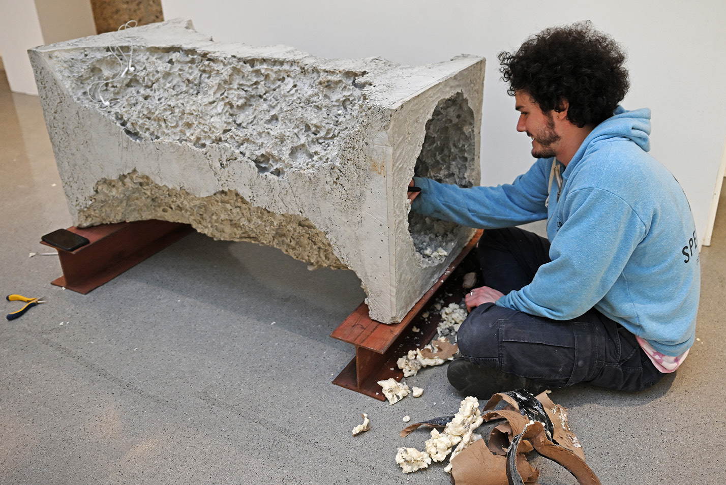 Student working on a piece of sculpture