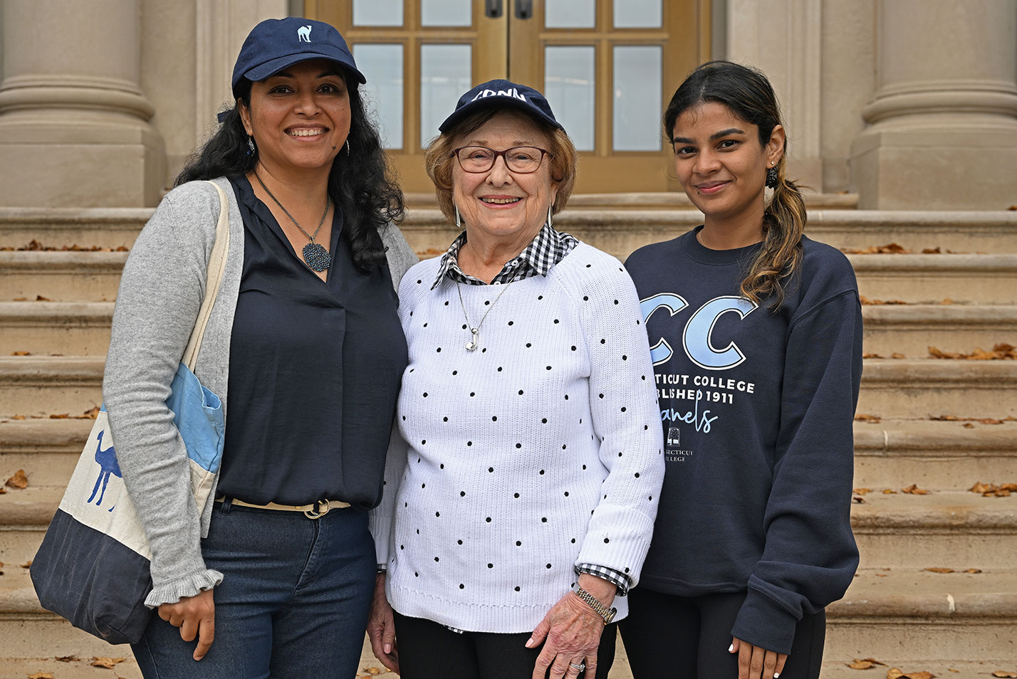 Three alums pose at Fall Weekend 2023