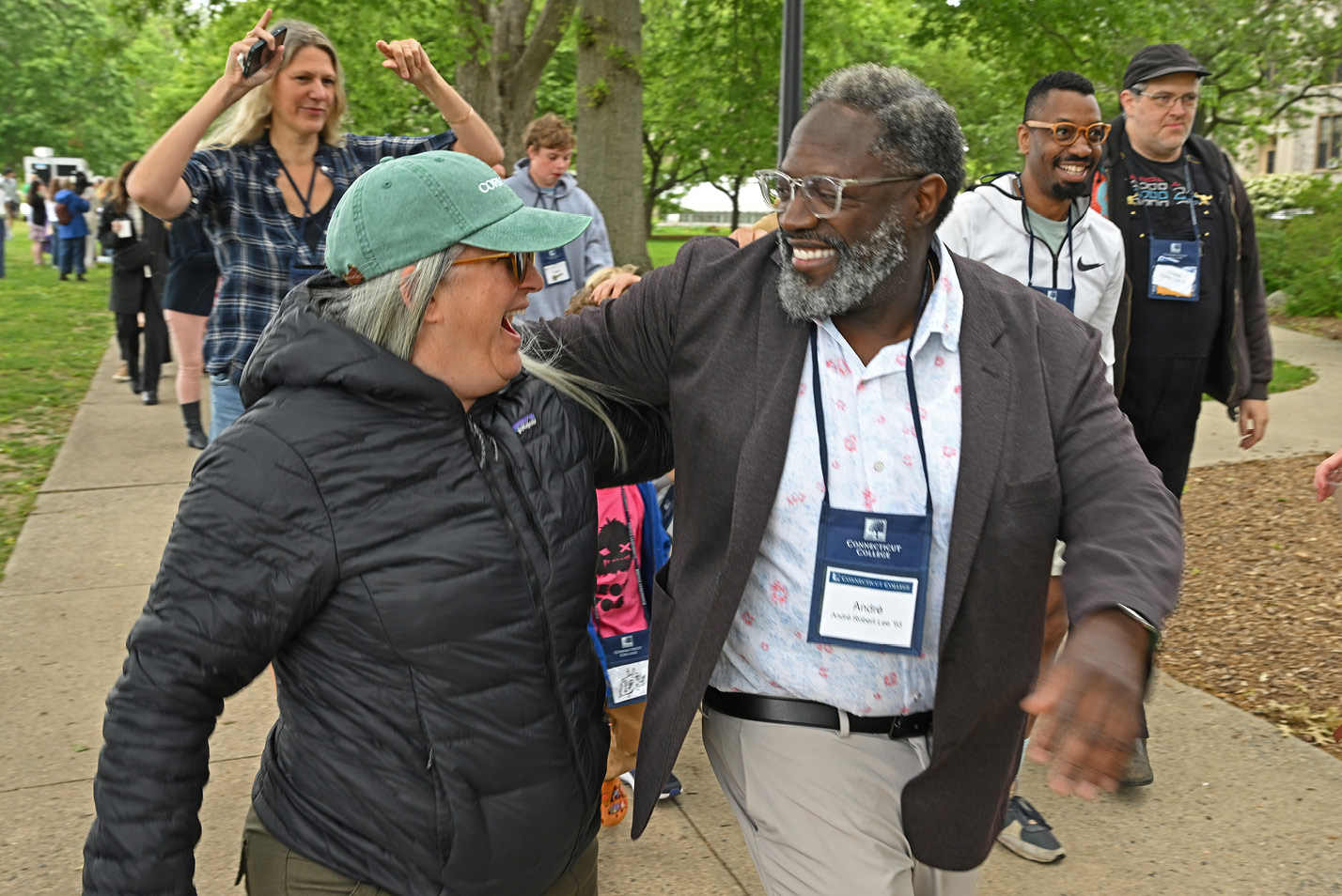 Alums smile and embrace during the Reunion parade.