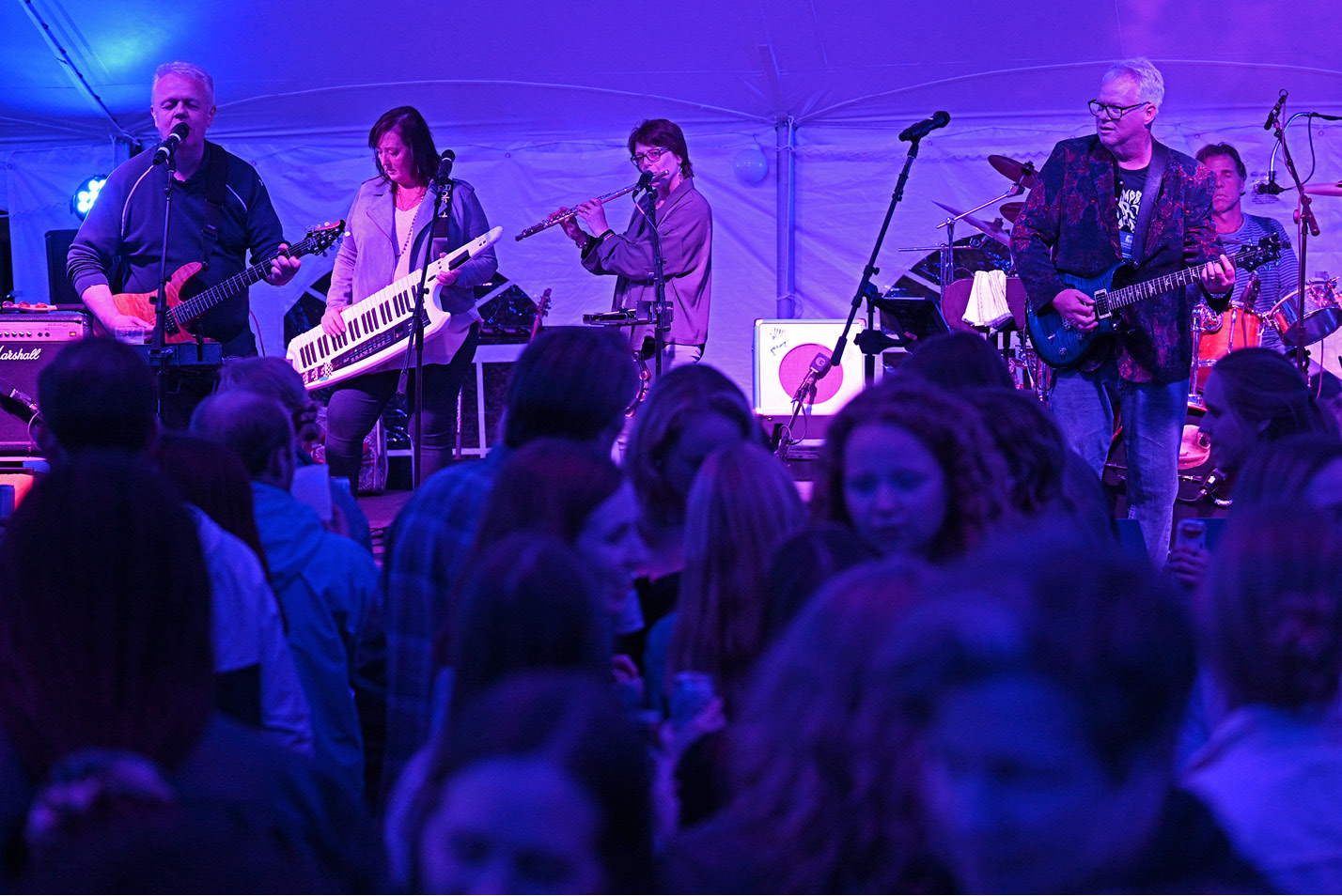 An 80's band performs under the tent at Reunion.