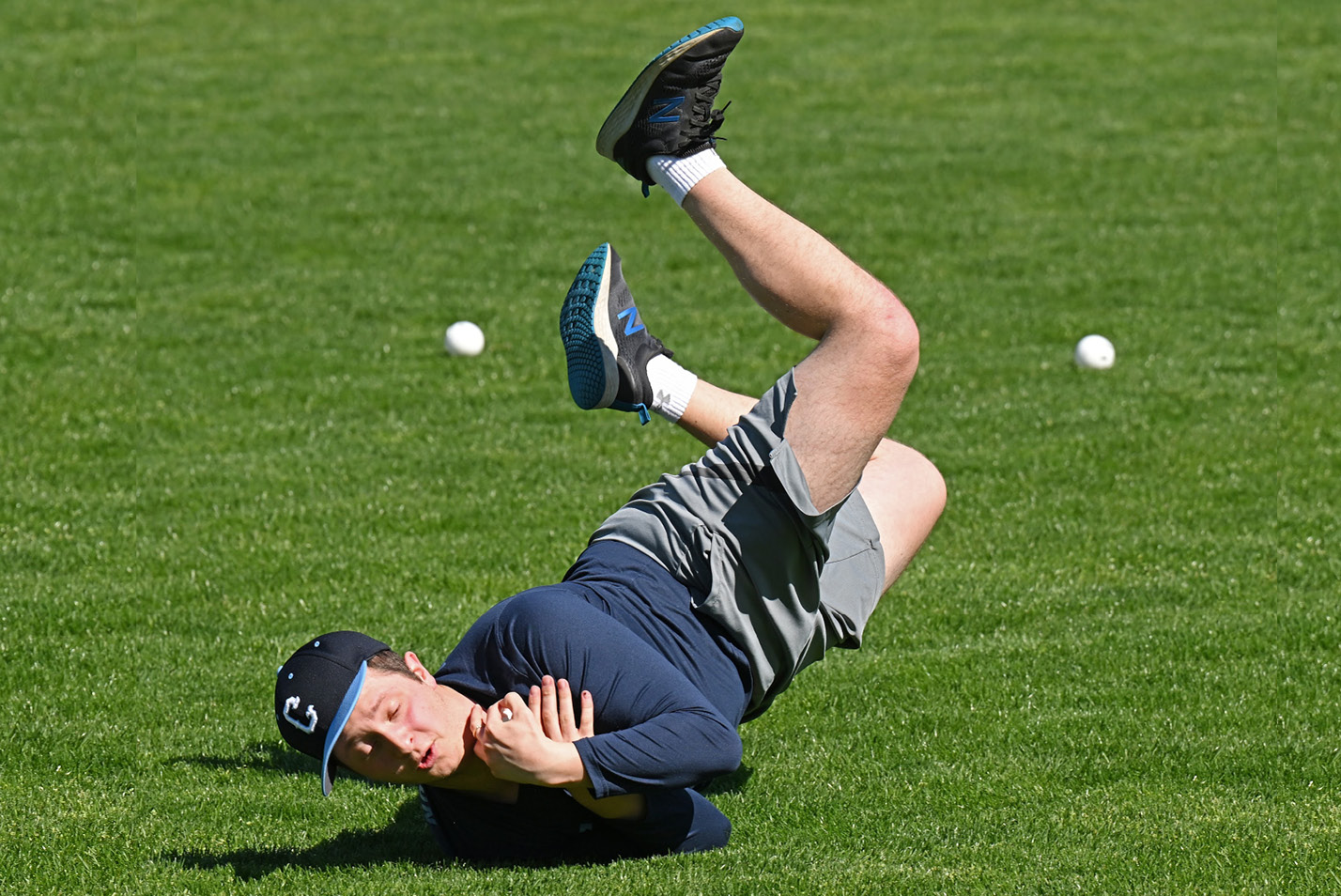 Student catches whiffle balls on the Green in May