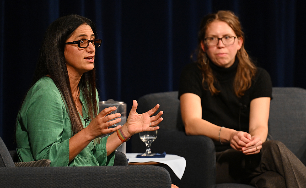 Mona Hanna-Attisha addresses the crowd while Julia Flagg, Associate Professor of Sociology and Environmental Studies, looks on.