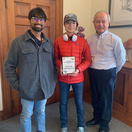 L-R: Adithya Saranathan ’26, Eldritch Williams ’27 and Interim President Les Wong with the Pan-American Intercollegiate Team Chess Championship Top Four-Year Small College trophy