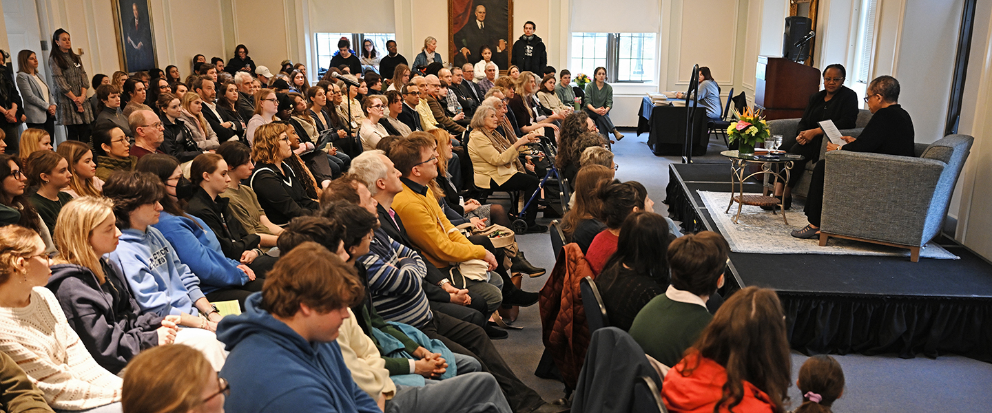 Professor Kate Rushin and author Edwidge Danticat take the stage before a packed audience.