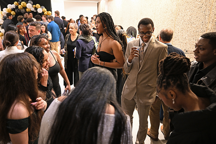 group of well-dressed students mingle