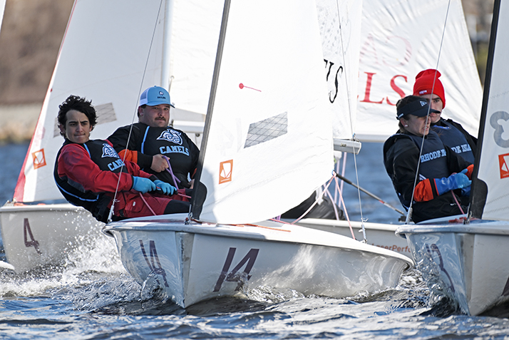 sailors compete in small boat regatta on choppy water