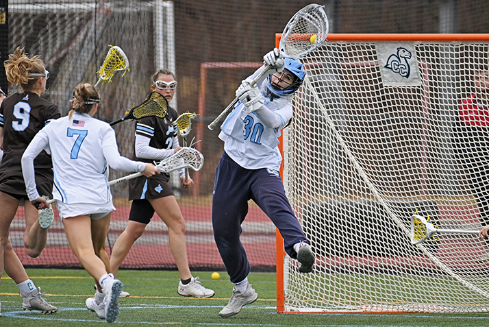 lacrosse goalie makes a leaping save