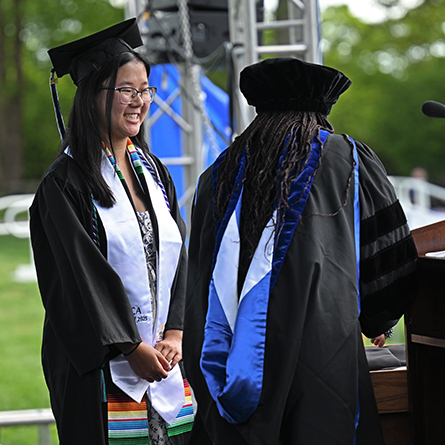 Ana Flood ’25 accepts the 2025 Anna Lord Strauss Medal at Connecticut College’s 107th Commencement on May 18.